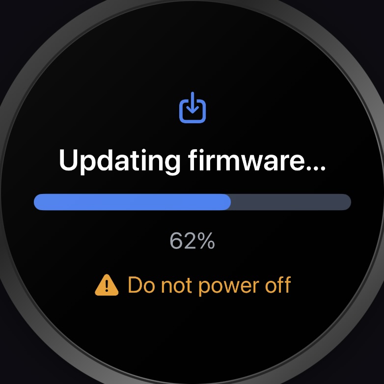 Round display showing an over-the-air firmware update in progress at 62 percent